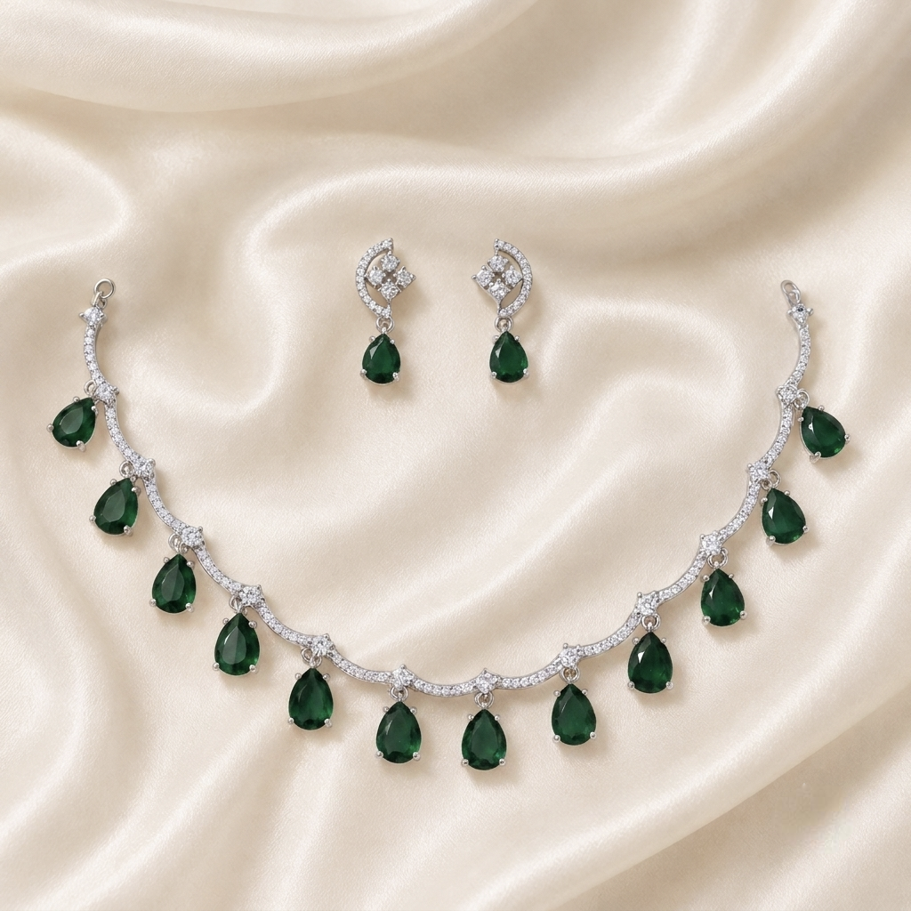Elyselle Rosalie Emerald AD Necklace Set on satin background