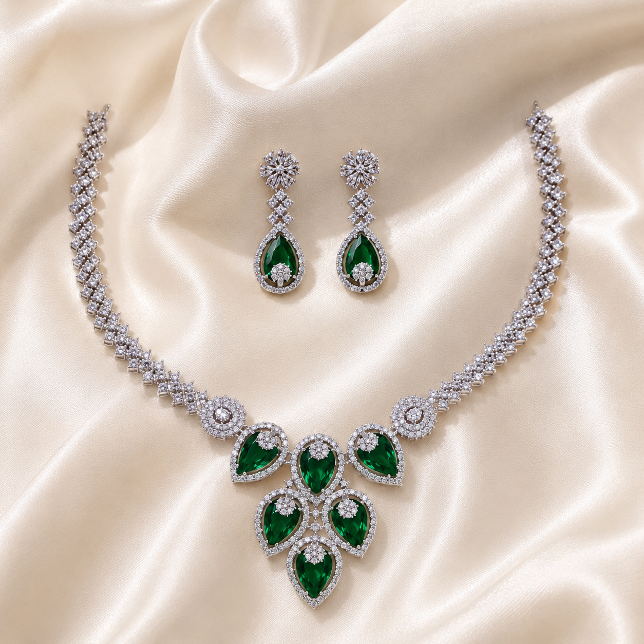 Elyselle Aurora Emerald AD Necklace Set on satin background