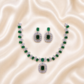 Elyselle Serene Emerald AD Necklace Set on satin background