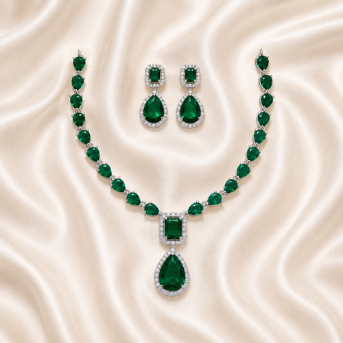 Elyselle Aurelia Emerald AD Necklace Set on satin background