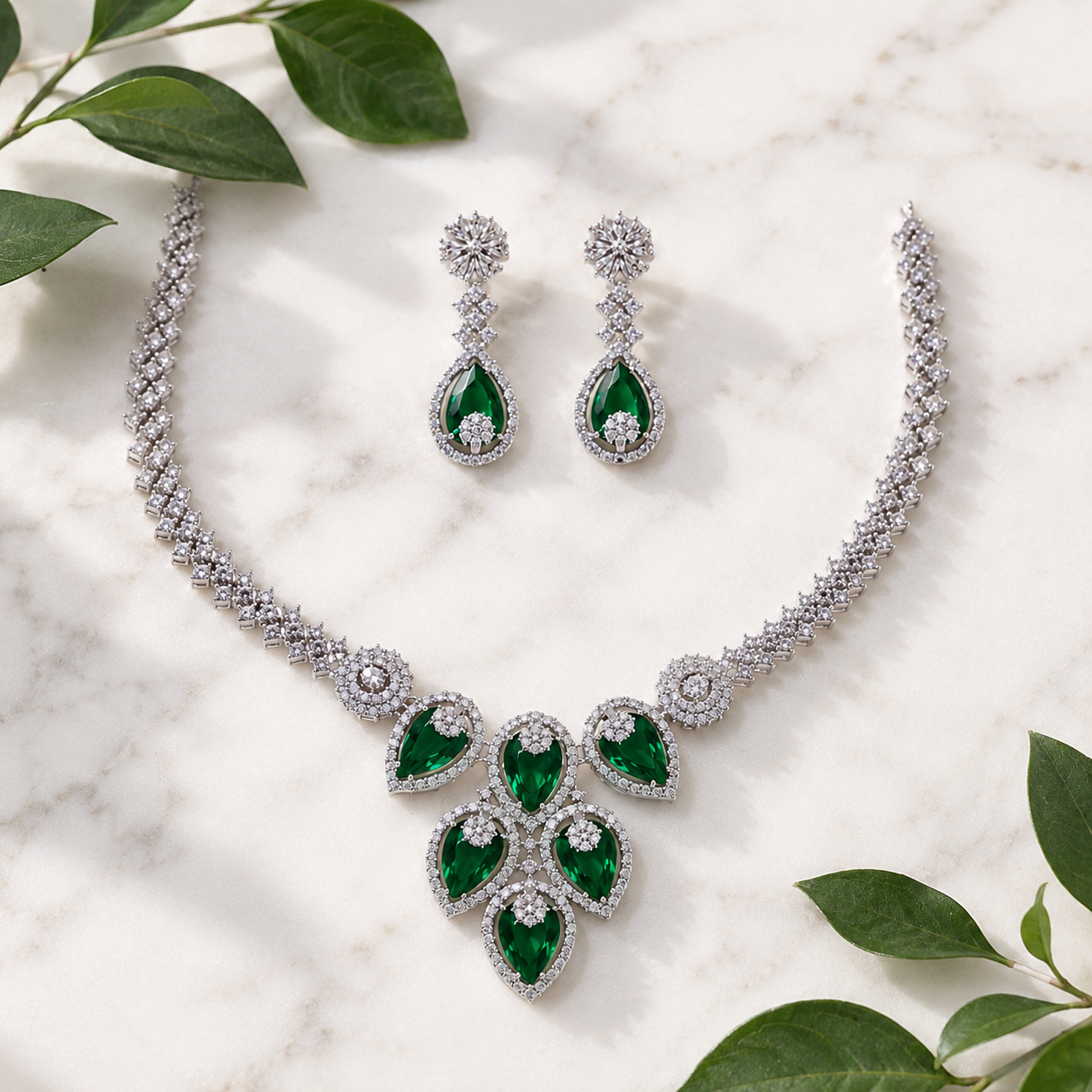 Elyselle Aurora Emerald AD Necklace Set on marble background